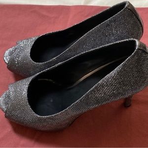 Nine West black and silver peep toe pumps worn once. Size 8.5 with 3” heel.